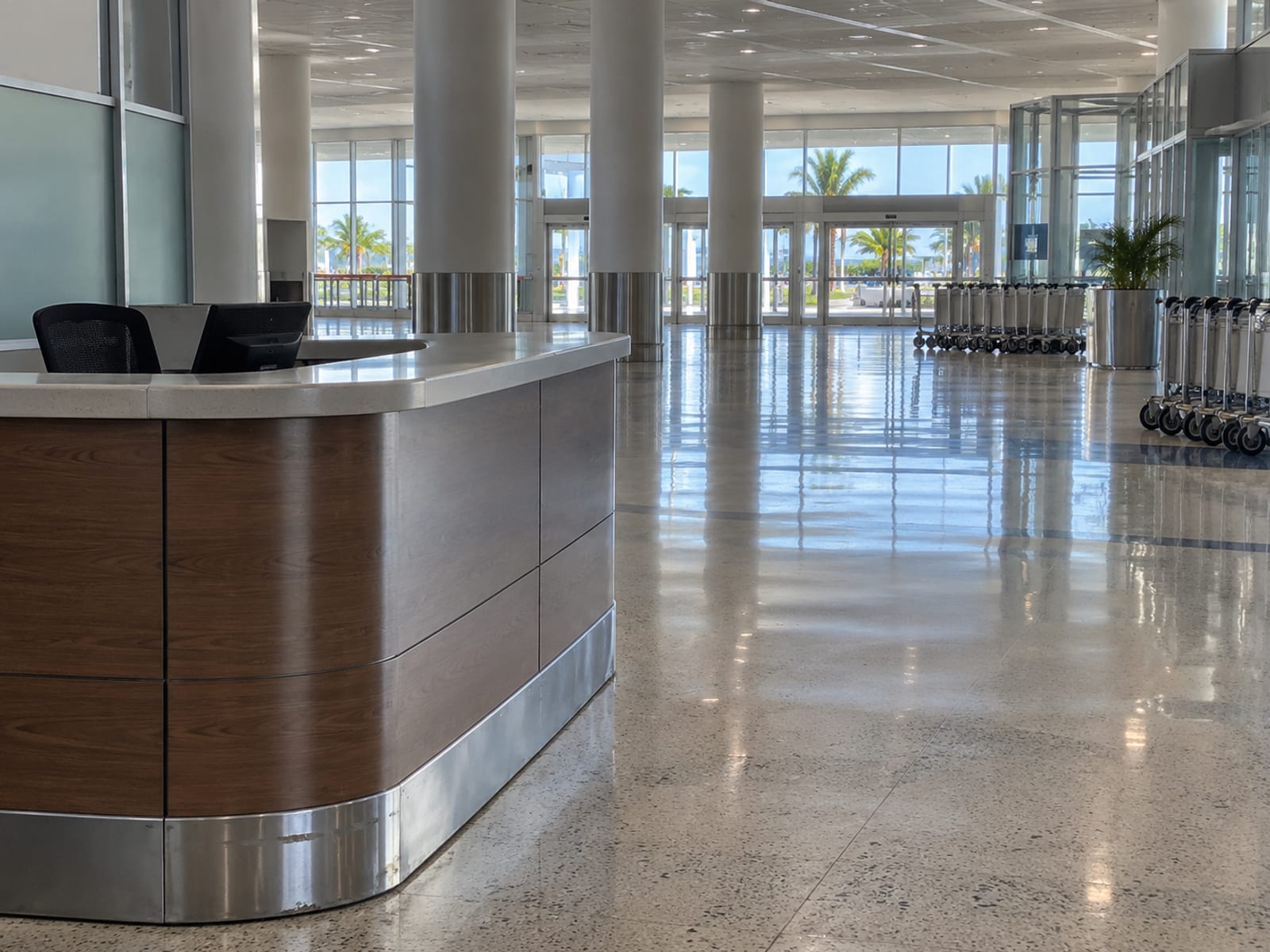 An airport arrivals hall with a taxi desk