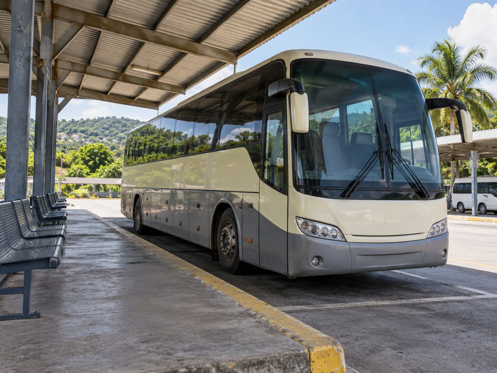 A coach parked at a bus terminal in Jamaica