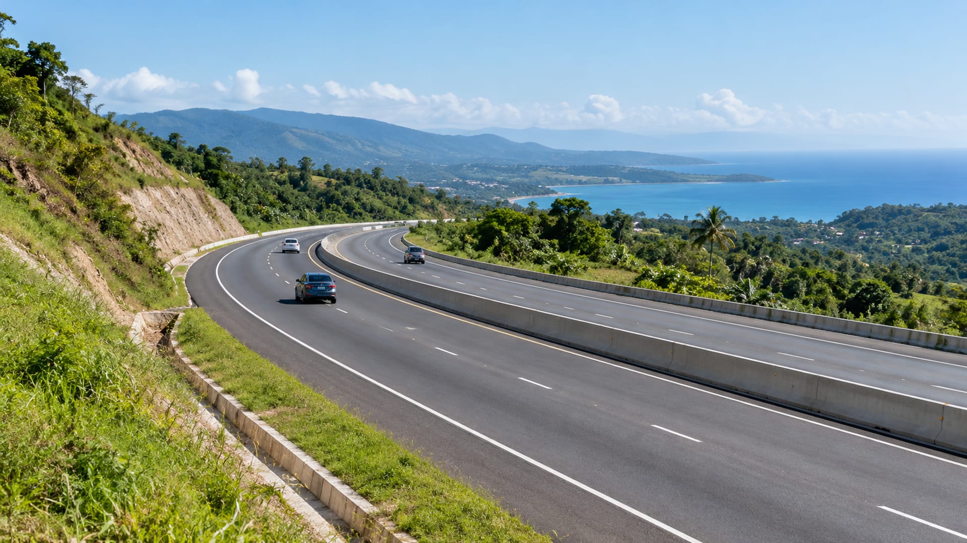 A new highway cutting through green hills towards the north coast