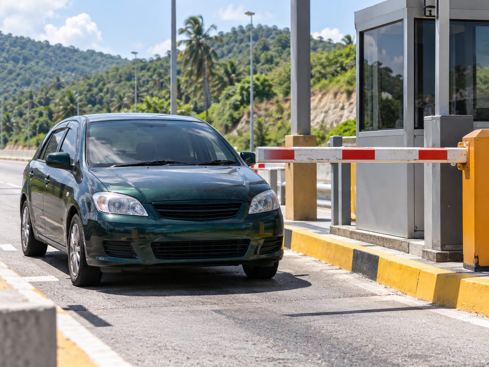 A car approaching a toll lane on a highway