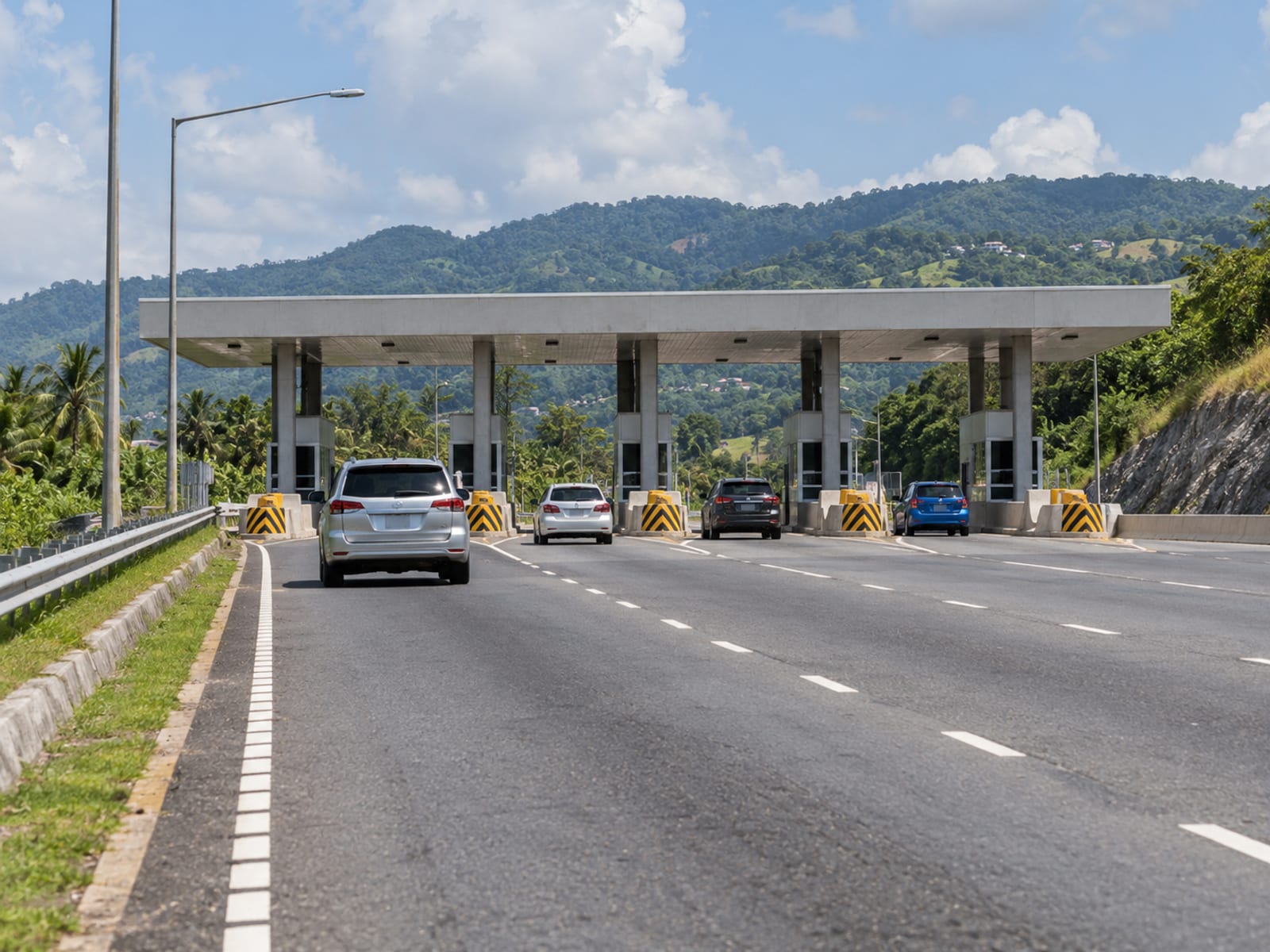 A multi-lane highway with a toll plaza ahead
