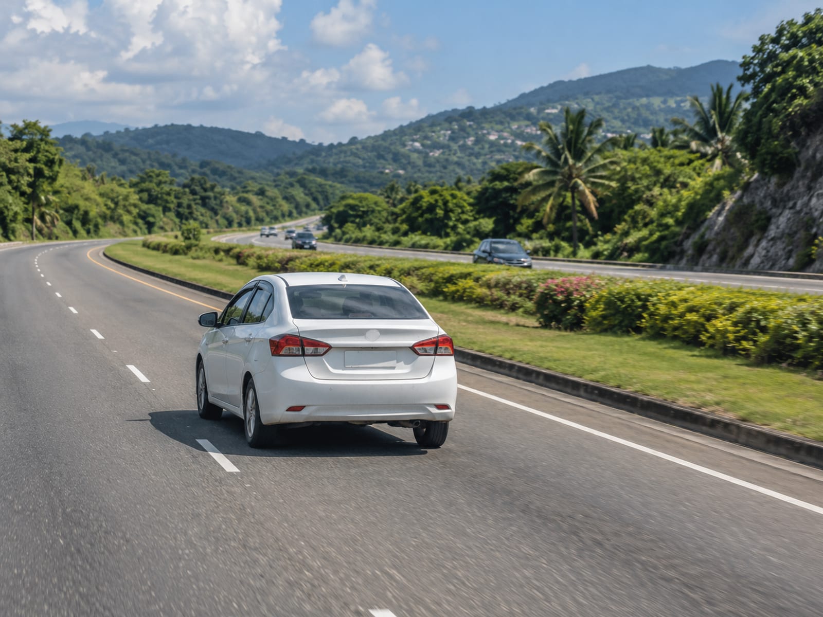 A rental car driving along a highway in Jamaica