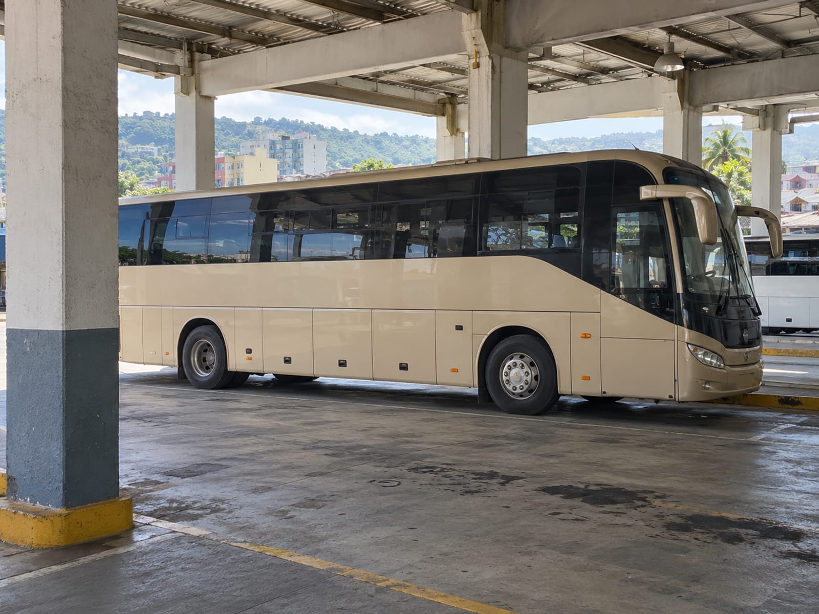 A coach waiting at a bus terminal in Kingston