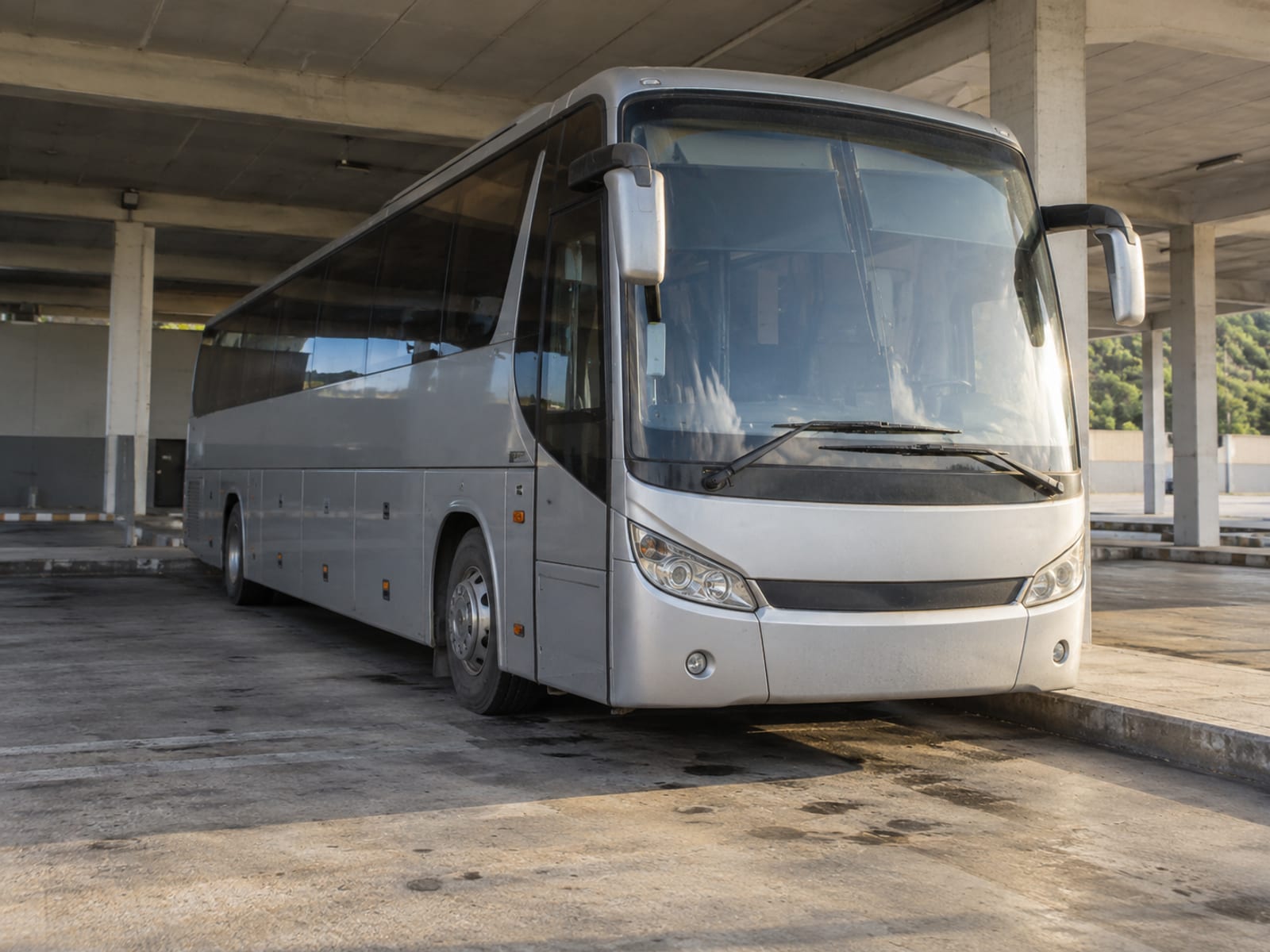 A long-distance coach waiting at a city terminal