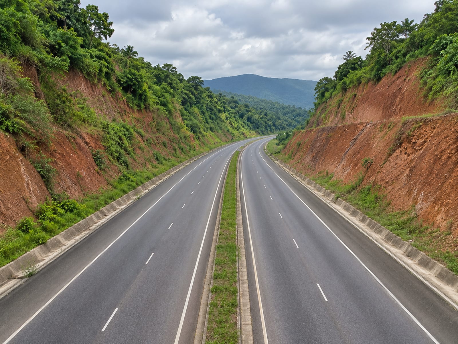 A highway through green hills in central Jamaica