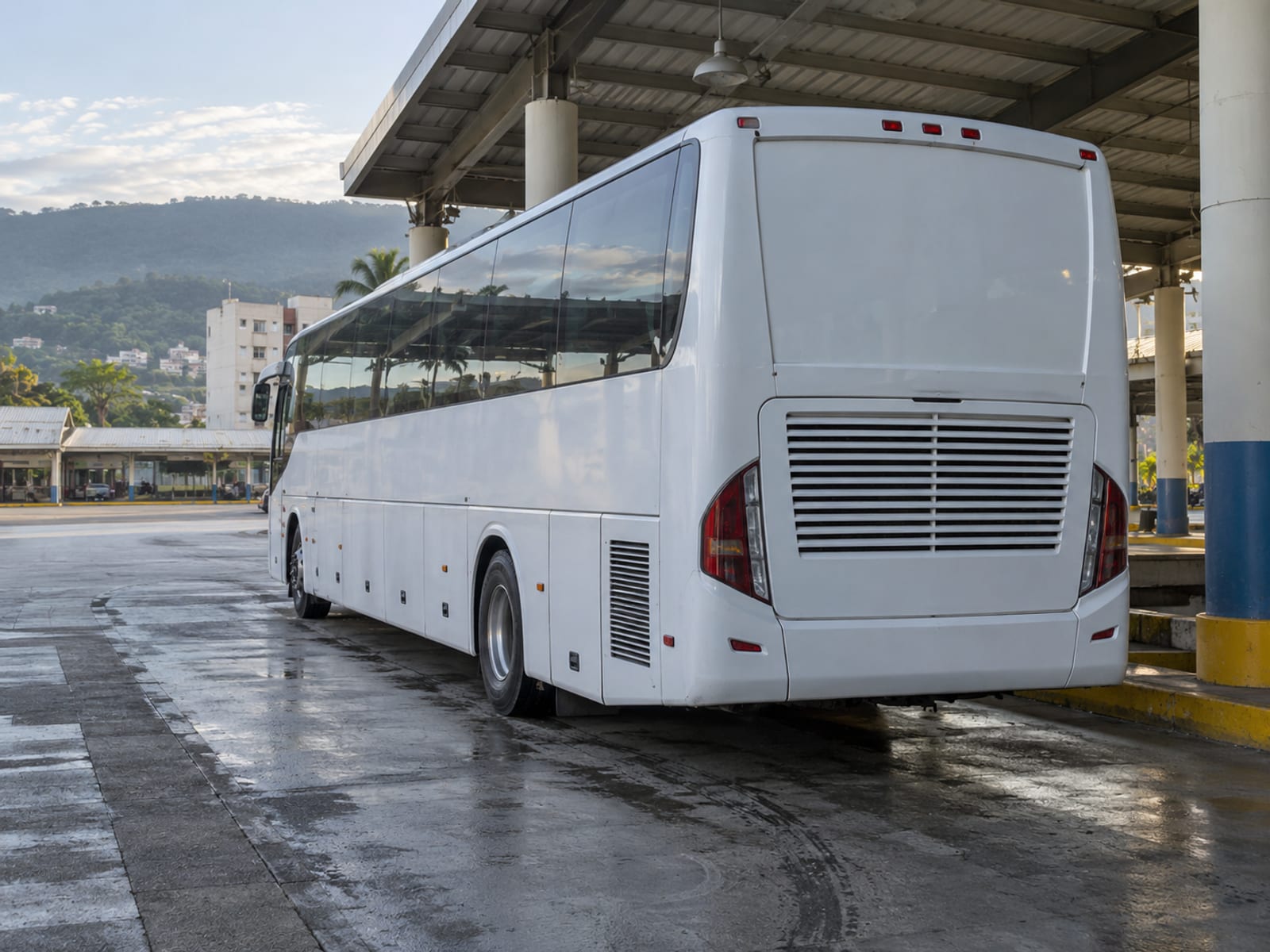 A long-distance coach parked at a city terminal