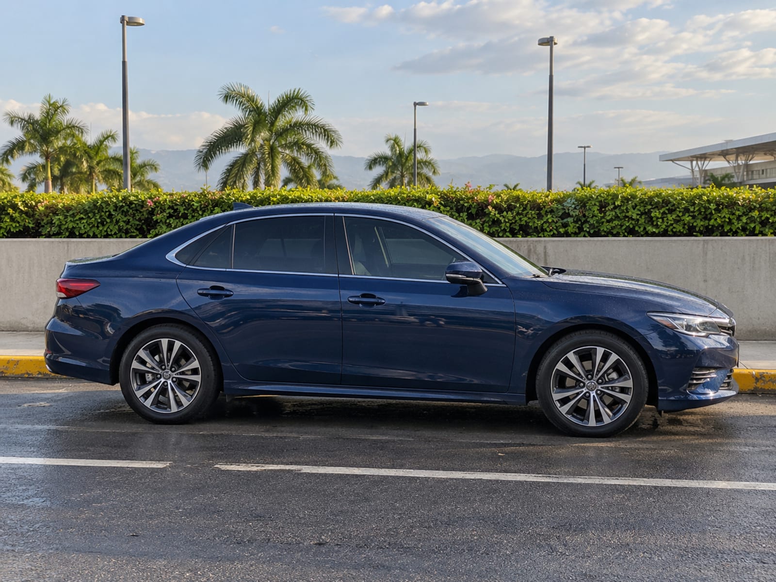 A private car waiting at an airport pickup area
