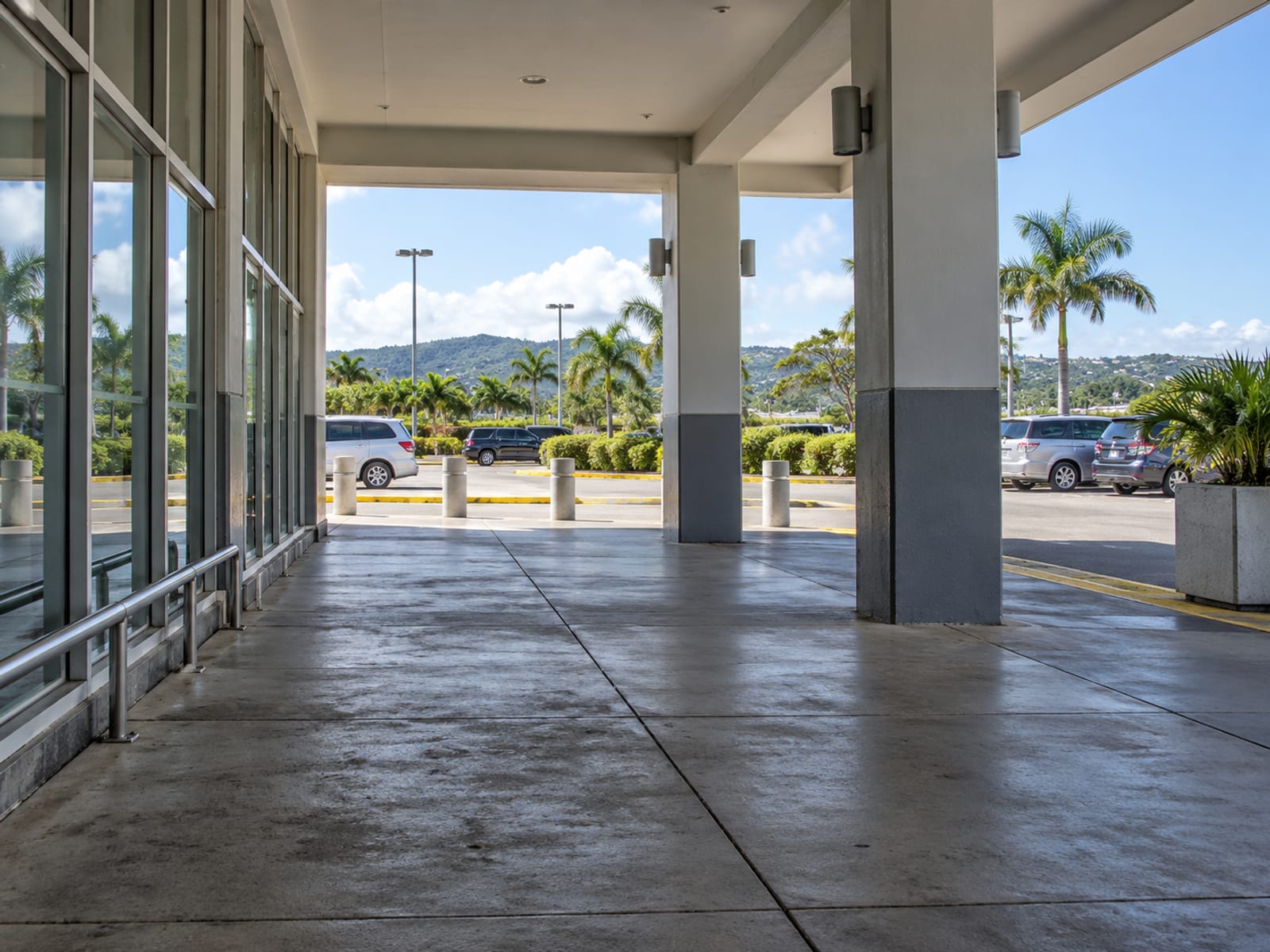 Travellers leaving an airport terminal toward the ground transport area