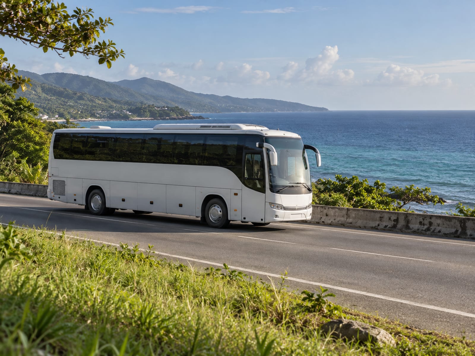 A coach on a north-coast road with the sea in view