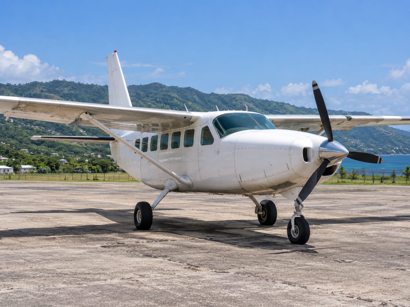 A small propeller aircraft on an aerodrome apron