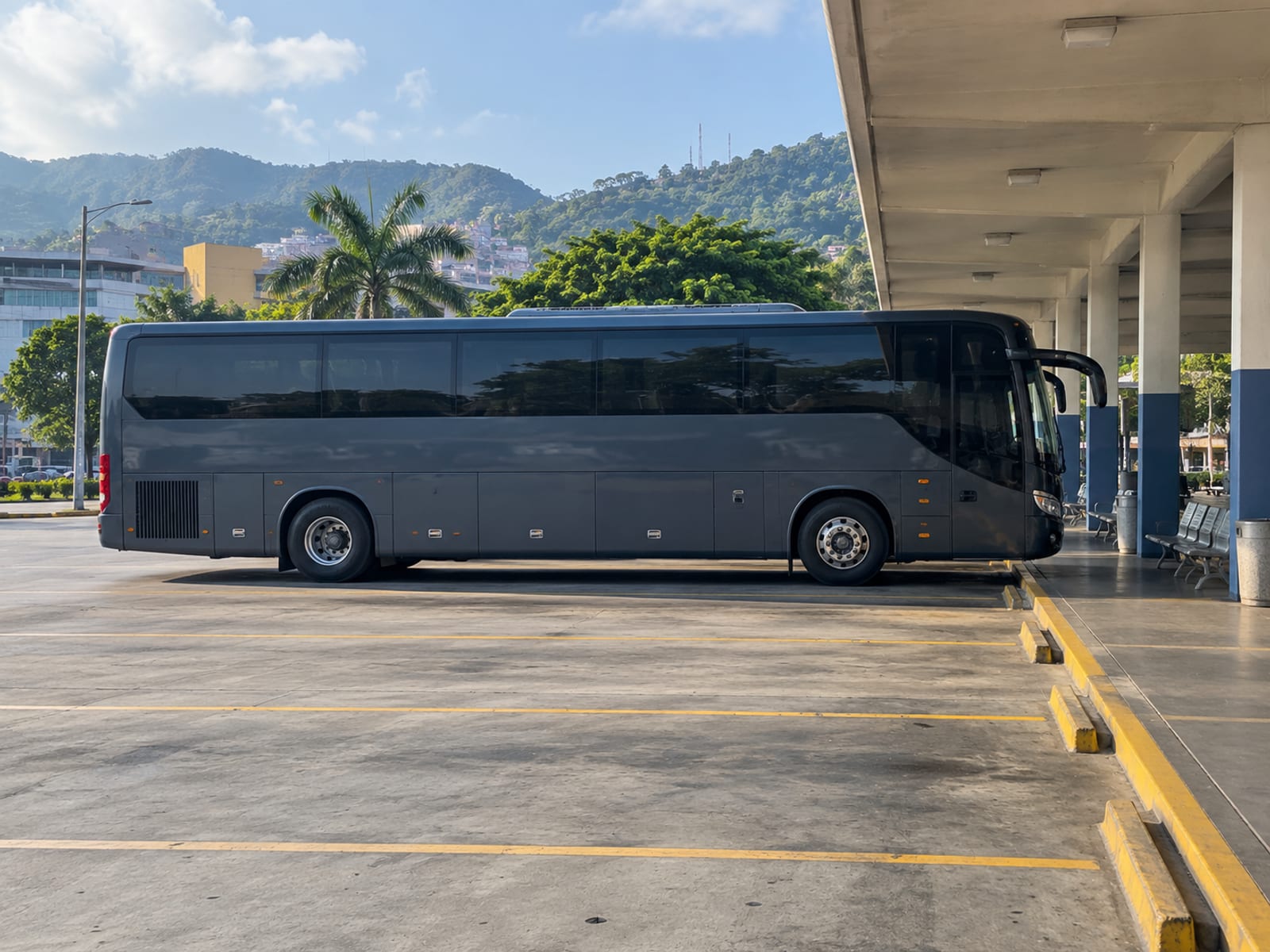 A premium coach waiting at a bus terminal