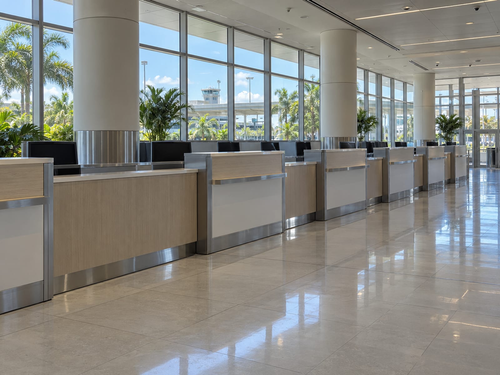 An airport arrivals hall with car rental counters